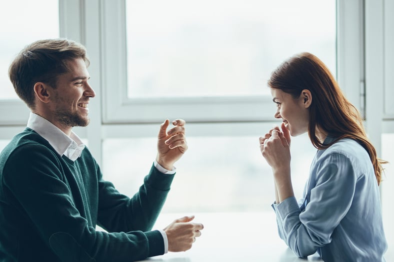 A Man and a Woman Are Sitting at the Table Communication Dating